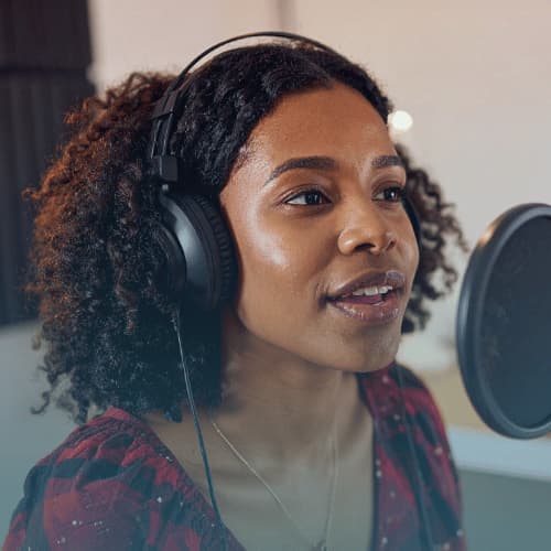 young women recording voice in studio
